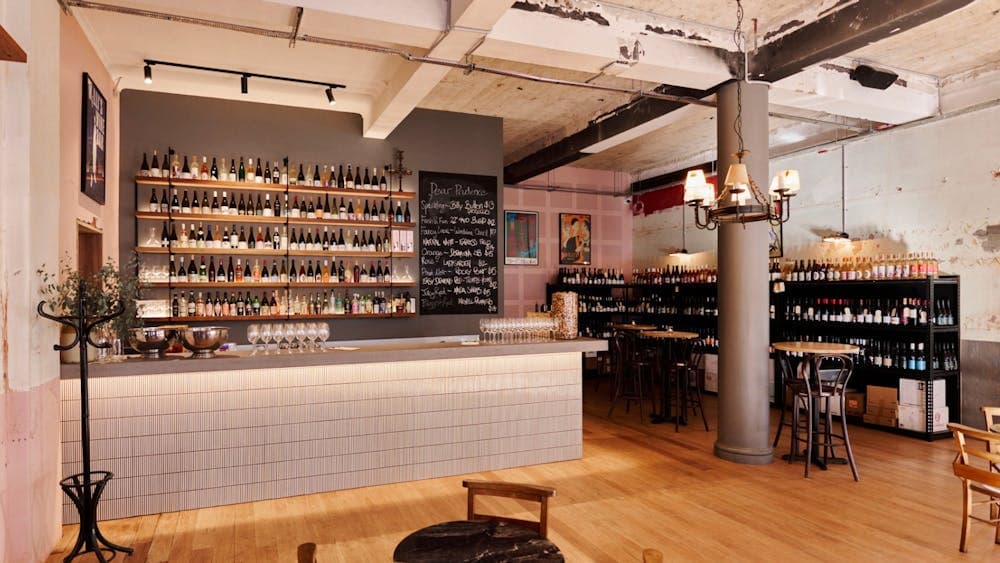 Bar with shelf full of different wines