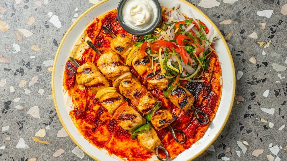Shish Tawook marinated chicken breast skewers with chilli bread and garlic, menu at Azima Lebanese