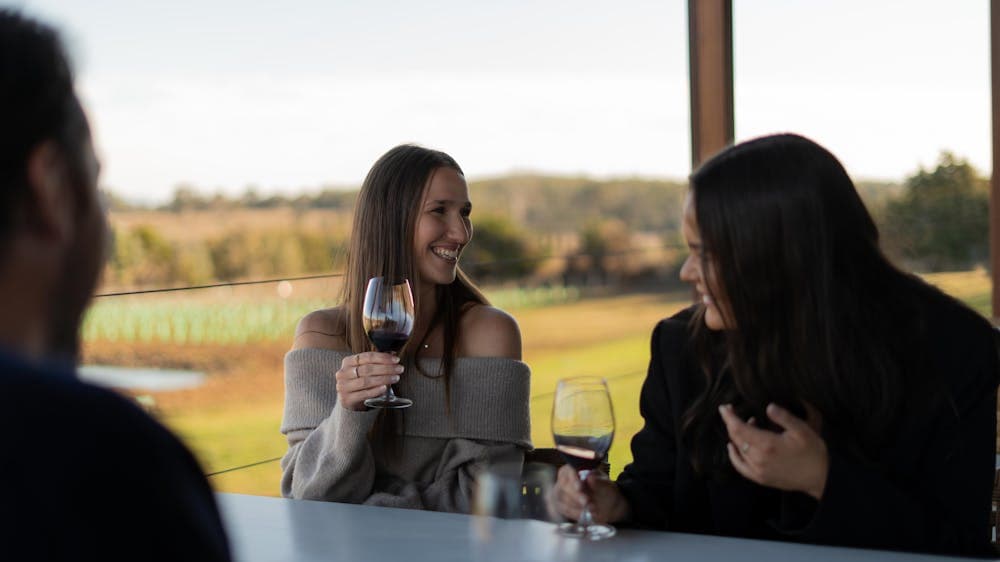 Wine Hopper guests enjoying a wine.