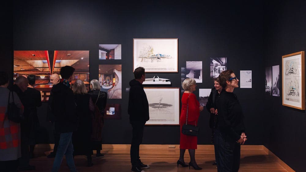 People exploring the Taglietti exhibition
