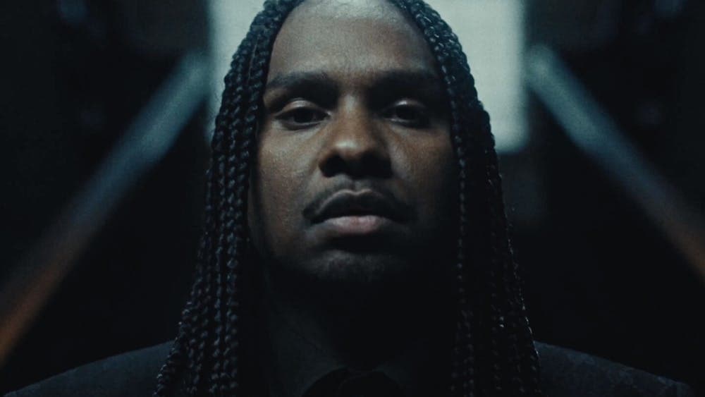 Close up of young males face looking striking towards the camera