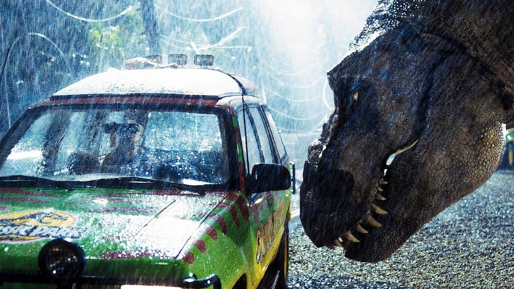 Dinosaur looking into a car