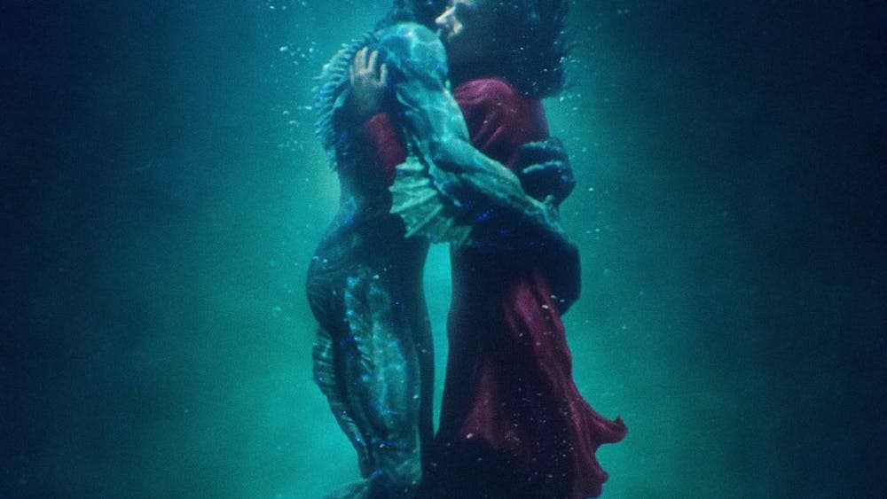 Merman and woman embracing under water