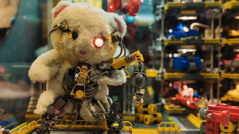 Closeup image of RELICS exhibition with vintage teddy bear and LEGO® elements